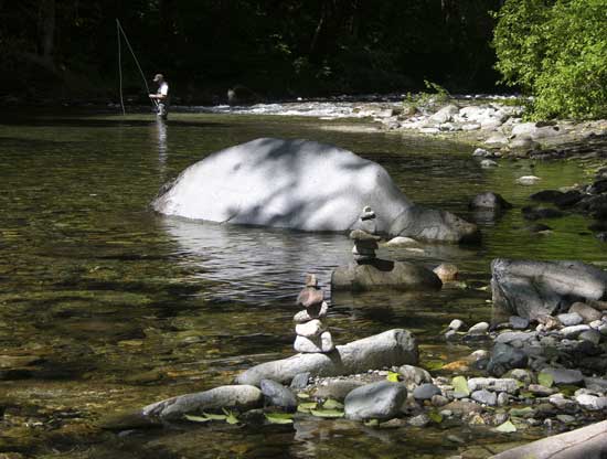 Fly fisherman on Beckler River, Skykomish Washington
